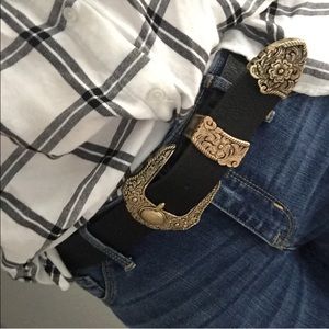 Black belt with gold floral design buckle